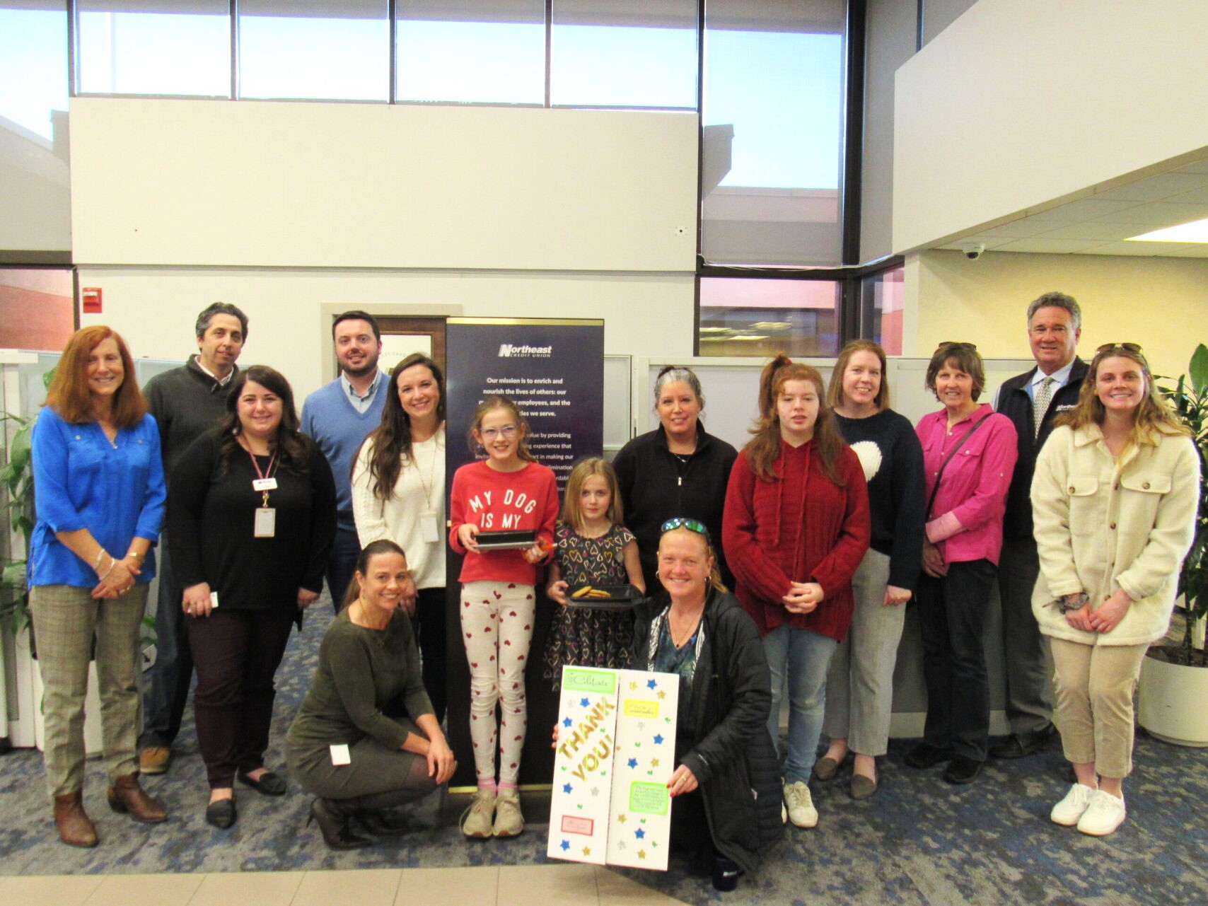 attendees at NorthEast community event posing for picture